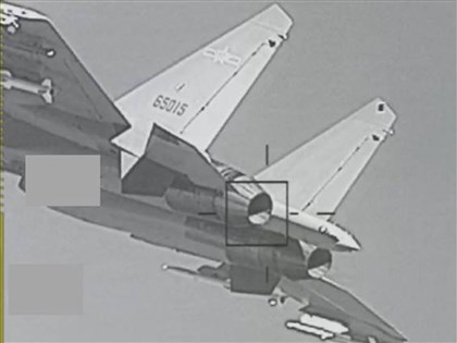 Taiwan military releases surveillance images of Chinese aircraft, warships