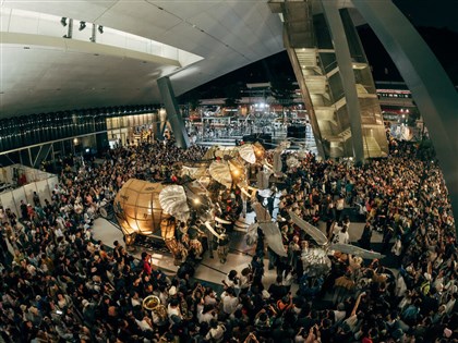 Thousands serenade French mechanical elephant parade with birthday song