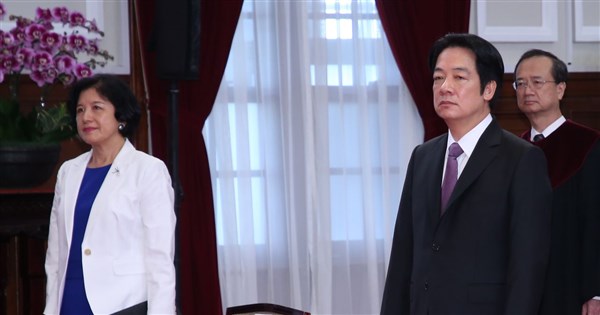 Lai's wife makes rare public appearance to endorse husband