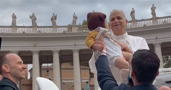 Pope Leo blesses a Taiwanese baby in Vatican City