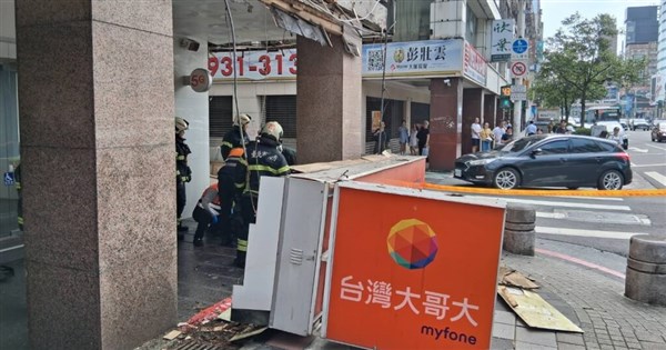 Falling telecom storefront sign injures two in Taipei