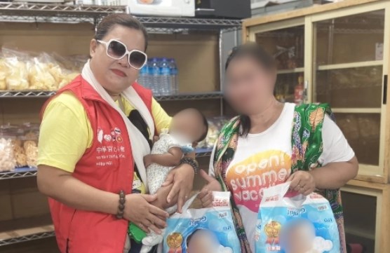  Ketua Serikat Peduli Pekerja International, Juli (rompi merah). (Sumber Foto : Juli)