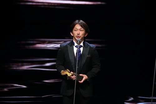 アクション設計賞の受賞スピーチをする谷垣健治