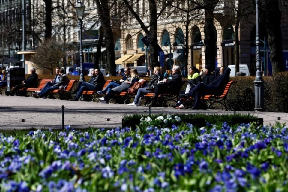 People enjoying ‍the sun in Helsinki, Finland