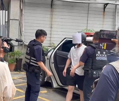 男疑酒後糾紛對台中商辦1樓大門開13槍 投案送辦