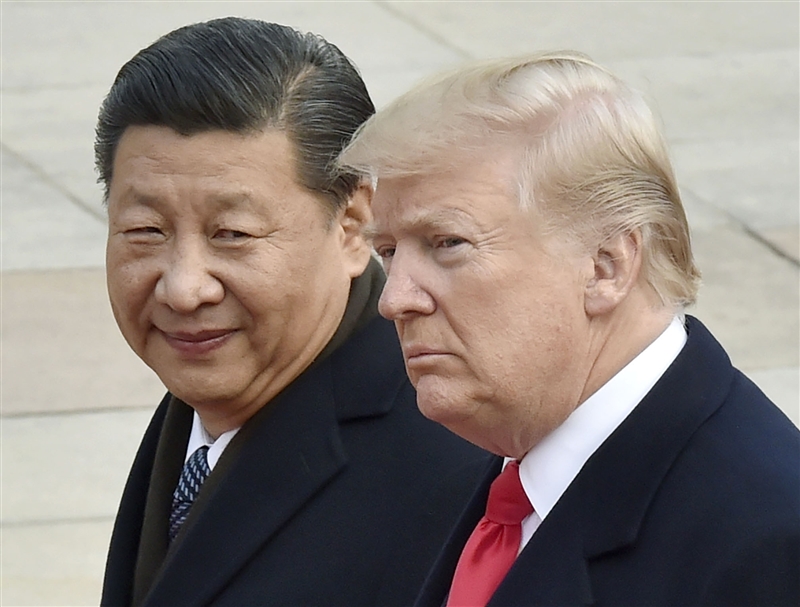 美中貿易戰威脅全球的成長與安全。圖為中國國家主席習近平(左)與美國總統川普。(檔案照片/共同社提供)