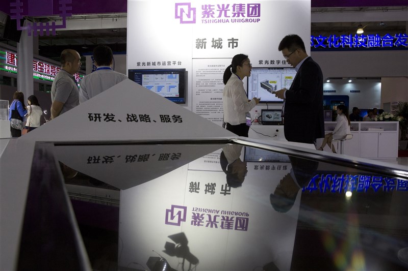 進入債務重整程序的中國紫光集團，近日傳出將進行債權人的債權清償程序。圖為2018年紫光集團參加第21屆中國北京國際科技產業博覽會。（美聯社）