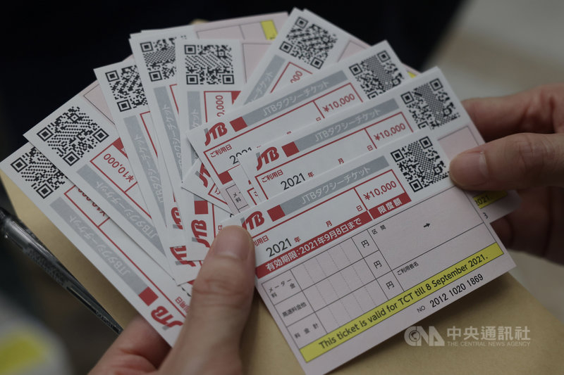 距日本東京奧運開幕進入倒數階段,為提供安全的賽事環境,東奧推出接駁計程車票券,提供媒體等賽事相關人員往返場館。中央社記者吳家昇攝 110年7月21日