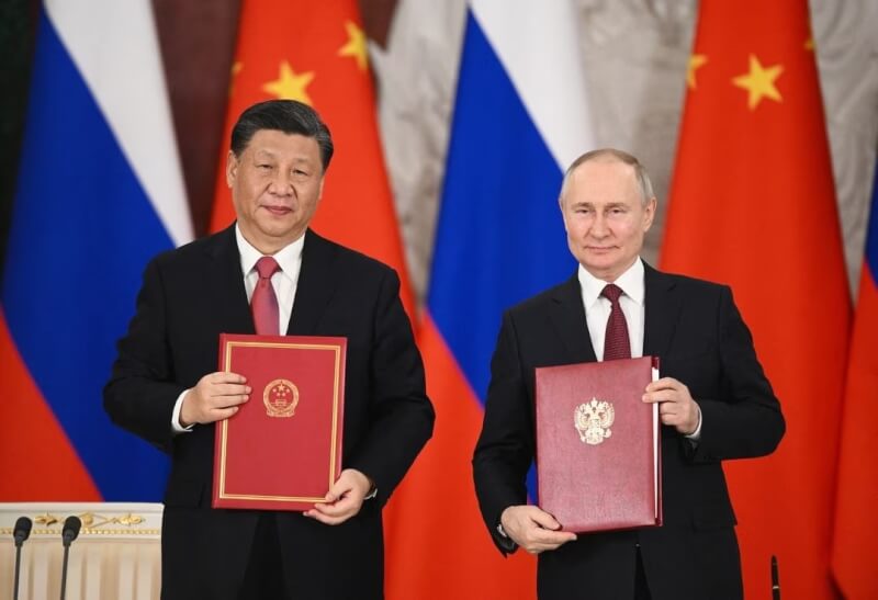 中國國家主席習近平（左）本週訪問莫斯科，與俄羅斯總統蒲亭（右）正式會談。（Sputnik/Sergei Karpukhin/Pool via 路透社）
