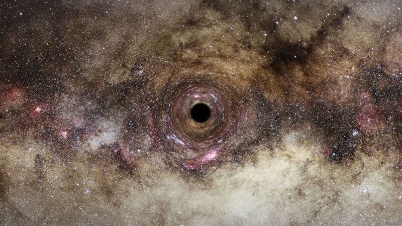 天文學家首度藉著新技術「重力透鏡」，發現一個超大質量黑洞，質量是太陽的300億倍以上。（圖取自英國皇家天文學會網頁ras.ac.uk；作者ESA/Hubble, Digitized Sky Survey, Nick Risinger , N. Bartmann，CC BY 4.0）