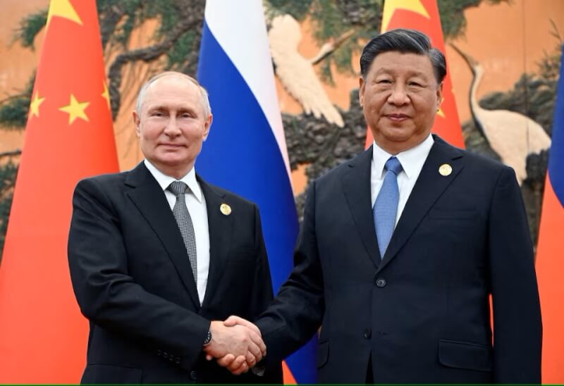 俄國總統蒲亭（左）和中國國家主席習近平（右）去年在北京一帶一路論壇會面。（Sputnik/Sergei Guneev/Pool via 路透社）