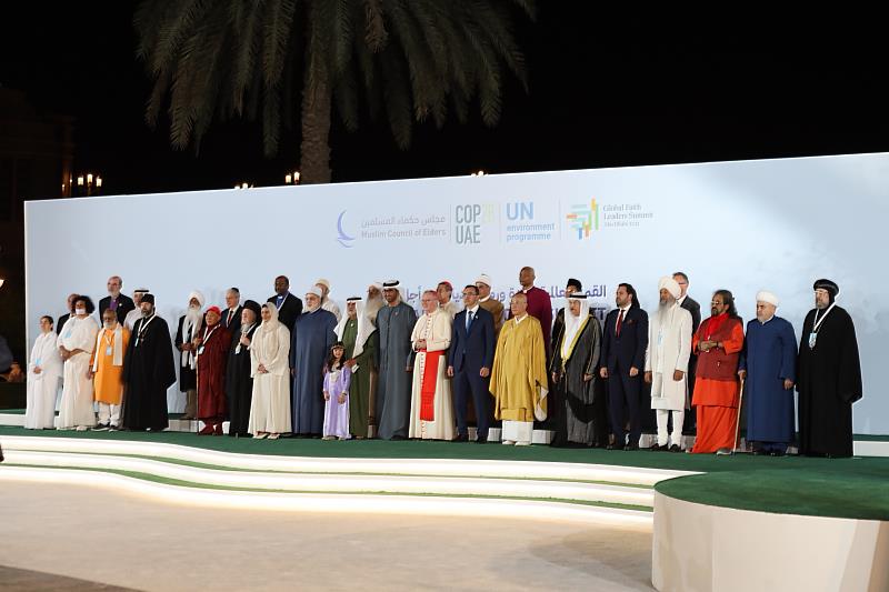 Representatives of the Global Religious Leaders Summit poses for a group photo with COP28 President Sultan Al Jaber.