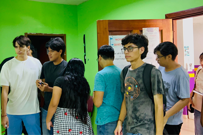 Examinees get ready to enter the test venue.