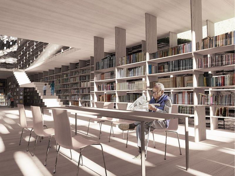 設計回應地形起伏與部落聚落結構，運用半戶外空間、層疊書牆與中庭閱讀場域，營造出兼具開放性與庇護感的閱讀體驗。