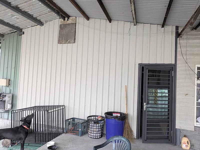 門諾基金會協助修繕後，大同村黃姓住戶牆面完成整修，居住環境改善。