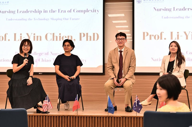 Faculty members, students and international speakers exchange ideas during the symposium’s discussion session.